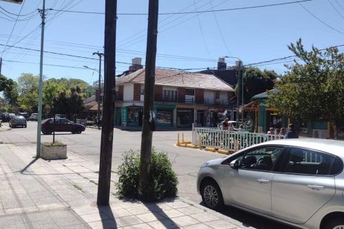 a silver car parked on the side of a street at Alquiler temporario 3 amb Parque Luro Mar del Plata in Mar del Plata
