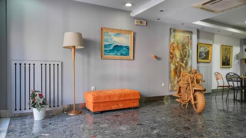a living room with a couch and a table at Diros Hotel in Athens