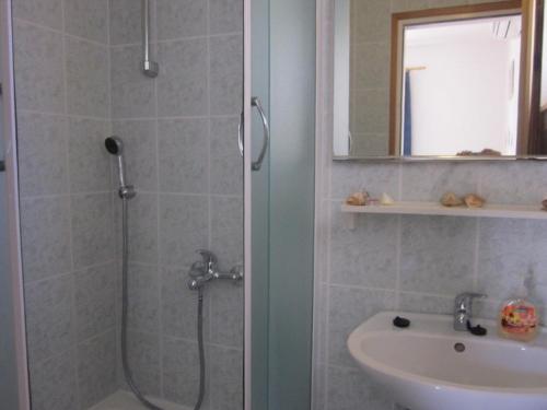 a bathroom with a shower and a sink at Apartments and rooms with WiFi Hvar - 20114 in Hvar