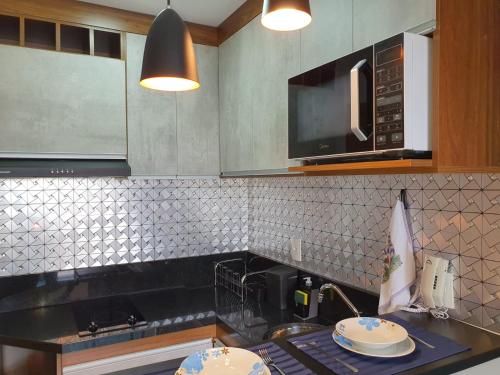Η κουζίνα ή μικρή κουζίνα στο Studio Novo e Aconchegante no Centro de Guarulhos