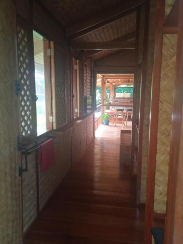 a hallway of a house with a dining room at At Home in Puerto Princesa City