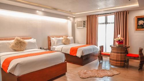 Tempat tidur dalam kamar di Aya Hotel & Residences