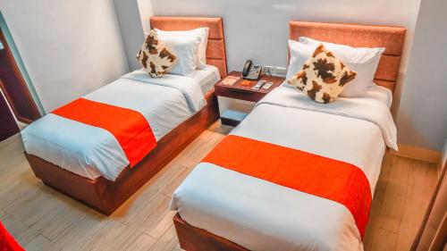 Aya Hotel & Residencesにあるベッド