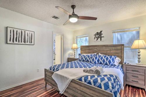 a bedroom with a bed and a ceiling fan at NEW! ATX Home with 3 Patios, 3 TVs, & Fire Pit in Austin