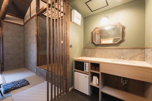 A kitchen or kitchenette at Traditional Apartment Takamatsu Guesthouse