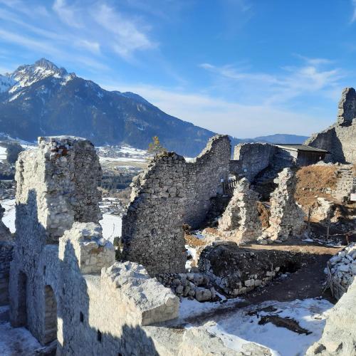 an old stone building with a mountain in the background at Ferienhaus Carmen in Grän
