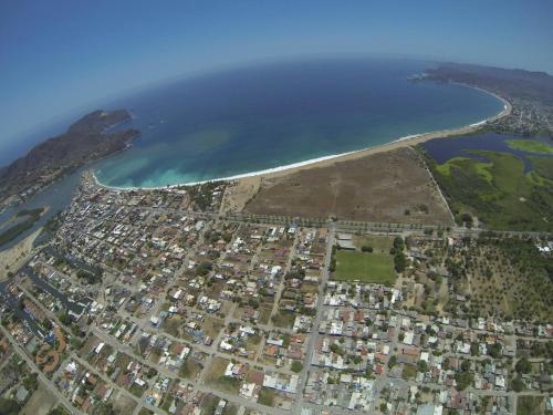 an aerial view of a city next to the ocean at Hotel La Alondra in Barra de Navidad