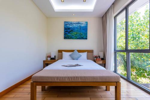 Ένα ή περισσότερα κρεβάτια σε δωμάτιο στο Sunny Beach Villa