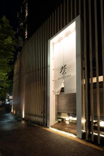 a lit up window of a building at night at HOTELみなと-MINATO- in Tokyo