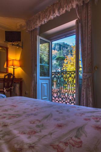 Postel nebo postele na pokoji v ubytování Hotel Sintra Jardim