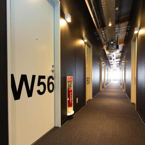 a hallway with a w sign on the wall at Ogal Inn in Yahaba