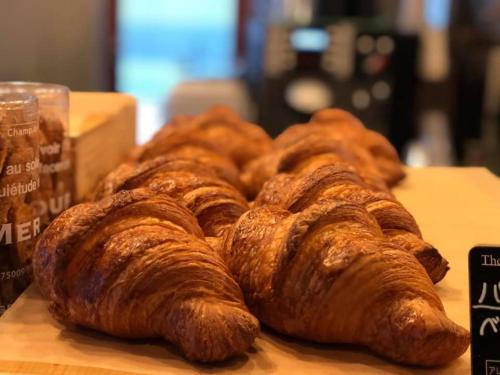 a group of croissants sitting on a table at Ogal Inn in Yahaba