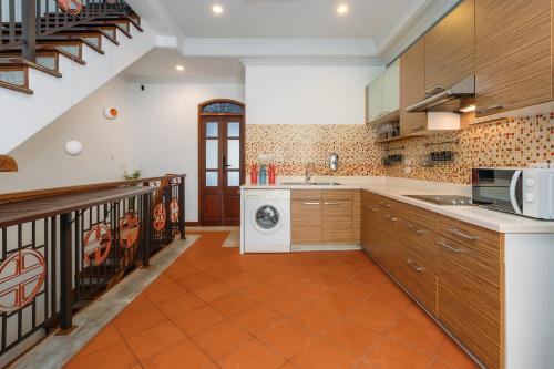 a kitchen with a washer and dryer at Botan Boutique Hotel in Patong Beach