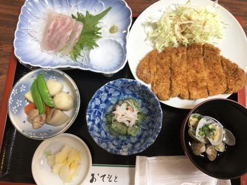 a tray with plates of food on a table at Imazato Ryokan in Osaka