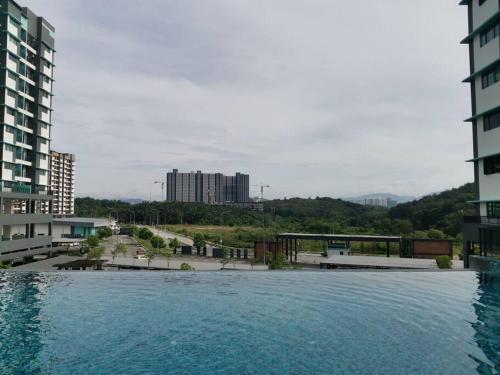 a large body of water in front of some buildings at Zanra Homestay at Residensi Zamrud Blok B in Kajang