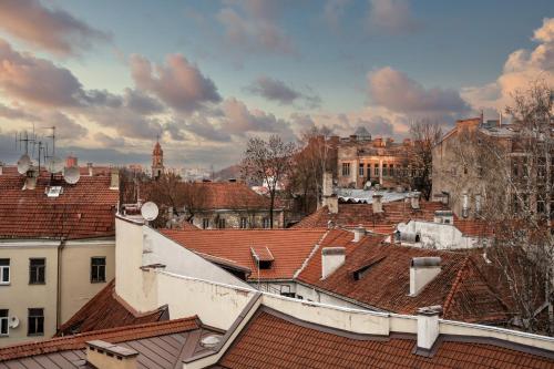 a view of roofs of a city with buildings at St Palace Hotel in Vilnius