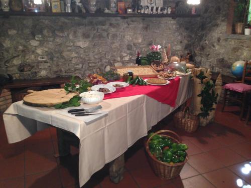a table with food on it in a room at Agriturismo Al Marnich in Schignano
