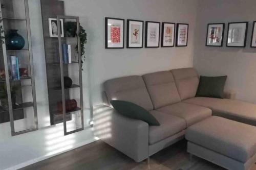 a living room with a couch and a chair at Casa Valla nuova e deliziosa dimora a Formigine in Formigine