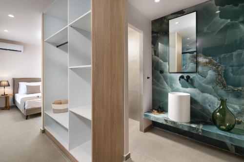 a living room with a wall of shelves at Mirena Luxury Living-Casa di Maria in Afantou