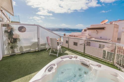 a hot tub on the balcony of a apartment at Hotel Aloe Canteras in Las Palmas de Gran Canaria
