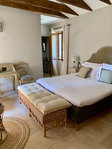 a bedroom with a large bed in a room at Château Le Cagnard in Cagnes-sur-Mer