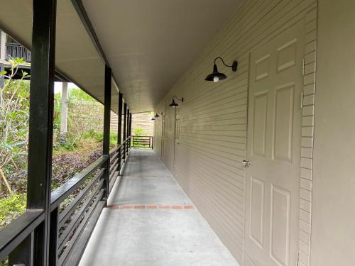 a hallway of a house with a white door at HIP Seaview Resort @ Phi Phi in Phi Phi Don
