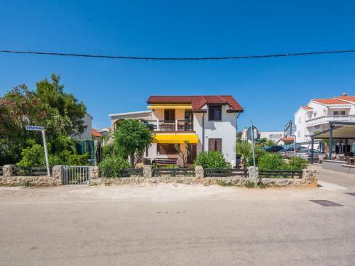 a house on the corner of a street at Apartments Sea Eyes in Vir