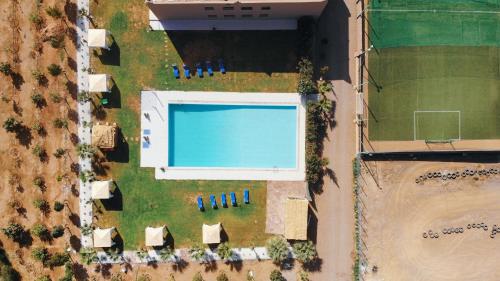 an overhead view of a large building with a swimming pool at lafamilia in Marrakech