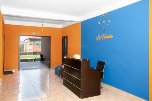 an office with a blue and orange wall at lafamilia in Marrakech