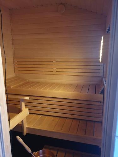 an empty refrigerator with its door open in a room at Mountainside Lodge - Breivikeidet in Tromsø