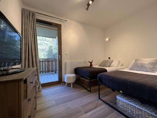 Posteľ alebo postele v izbe v ubytovaní LES FREINETS - Apt D02 - BO Immobilier - Châtel - Multipass été 2025 offert
