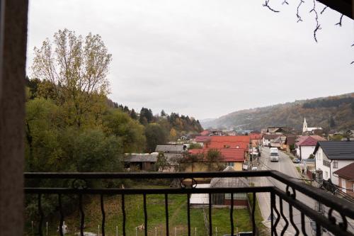 a view of a city from a balcony of a town at Pensiunea Lido Moisei in Moisei
