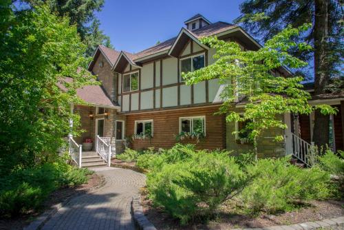 a large house with a pathway in front of it at Coeur de Lion BNB in Coeur d'Alene