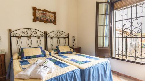 Posteľ alebo postele v izbe v ubytovaní La Casa de Isabel Villaviciosa de Córdoba by Ruralidays