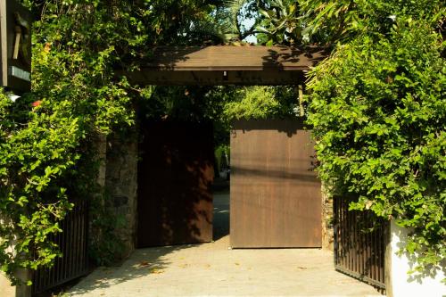 an entrance to a garage with a metal gate at River Arc Bolgoda Villa in Panadura
