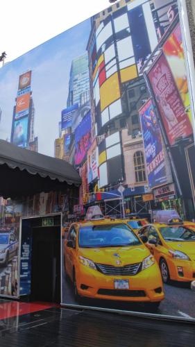 a yellow car is parked in a city at Reef Hotel in Johannesburg