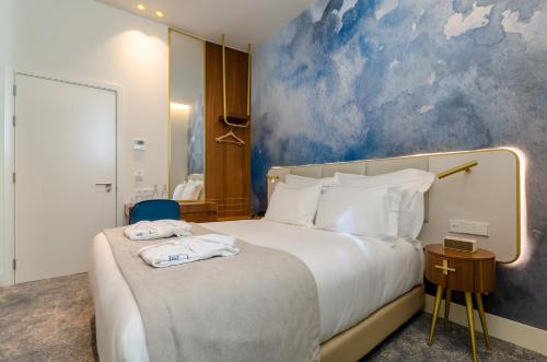 Katil atau katil-katil dalam bilik di Blue Liberdade Hotel