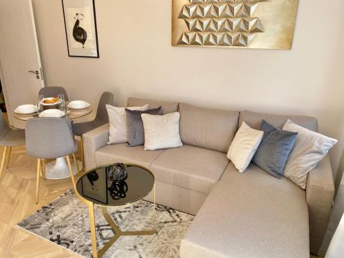 a living room with a couch and a table at Business & Family Apartment for 6 Guests with Free Parking in Stara Zagora