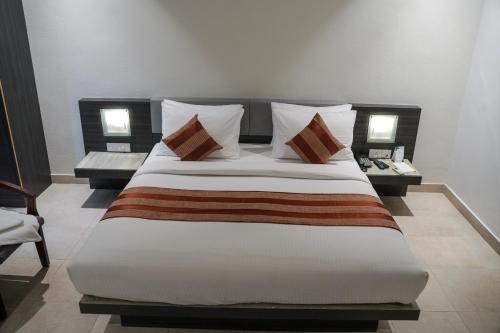 Postel nebo postele na pokoji v ubytování Hotel Palm shore