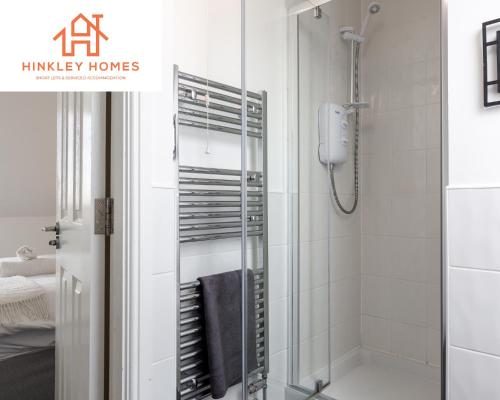 a bathroom with a shower with a glass door at 5 Beds - Free Gated Parking - City Centre - By Hinkley Homes Short Lets & Serviced Accommodation in Liverpool