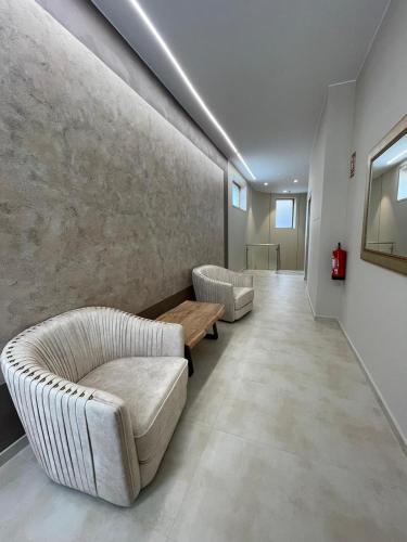a living room with two couches and a table at El Roble 9 in Astorga