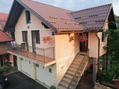 an image of a house with a metal roof at Holiday Home Lana in Fužine