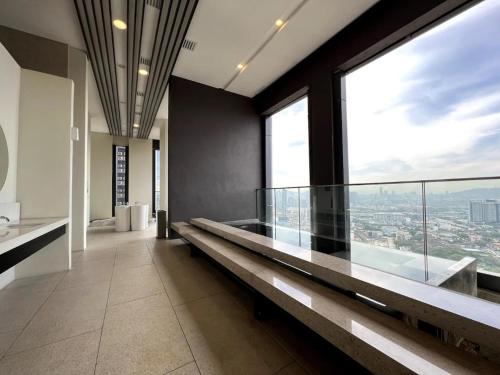 a large room with a large window in a building at Maxhome at Lucentia Bukit Bintang City centre KL in Kuala Lumpur