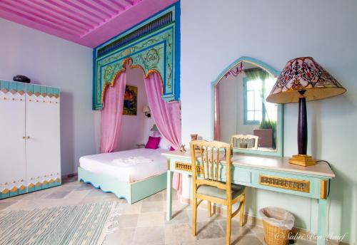 Postel nebo postele na pokoji v ubytování Dar Lekbira Boutique Hôtel