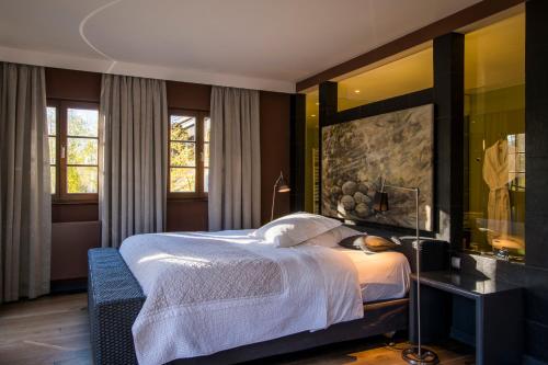 Postel nebo postele na pokoji v ubytování Hôtel le Moulin