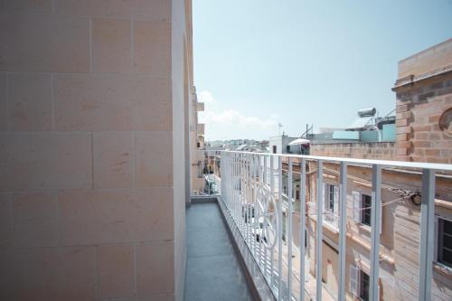 a view of a balcony from a building at The Three Trees Apartments in Sliema