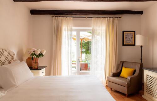 Una cama o camas en una habitación de Il Pellicano