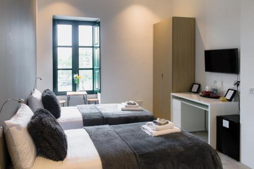 Postel nebo postele na pokoji v ubytování Privilege Suite