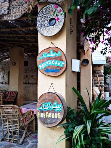 a sign that says restaurant the house on a wall at Zad El Mosafer Guest House in Tunis