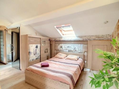 a bedroom with a large bed in a room at Love Room Jacuzzi Croisette in Cannes